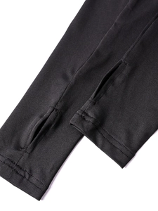 Close-up of black milk silk dress sleeve featuring functional thumb hole detail