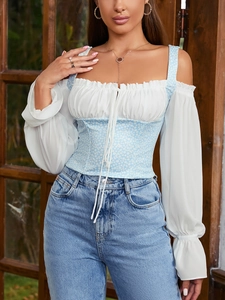 Detail view of floral bodice with sheer chiffon flare sleeves and drawstring tie