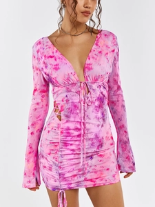 Detail of pink tie-dye mesh mini dress with deep V-neck, ruched drawstrings and side cut-outs