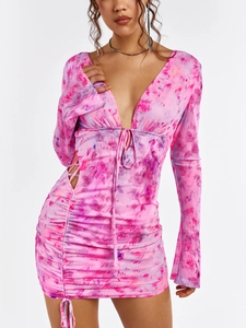 Detailed close-up of mesh tie-dye fabric with ruched texture and side hollow out design