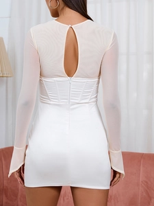 Detail of white mesh patchwork dress featuring a keyhole back and fishbone corset waist