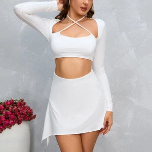 White two-piece set featuring long sleeve halter crop top and mini skirt for women