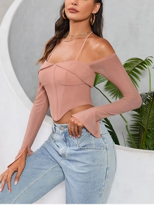 Detail of mauve off-shoulder corset top with sheer mesh sleeves and halter neck design