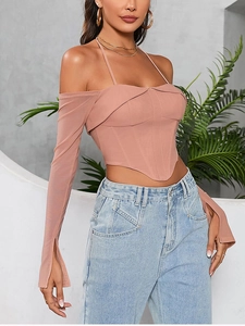 Detail of off-shoulder mesh top showing lace-up neck and sheer flared sleeves