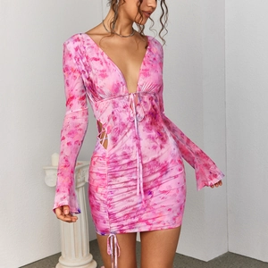Pink tie-dye bodycon mini dress featuring mesh cut-outs, deep V-neck, and side drawstring details