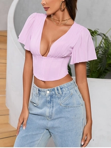 Detail of lavender chiffon corset crop top with ruffled sleeves and deep V-neckline