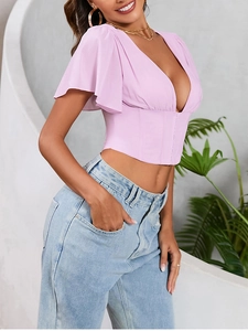 Detail of light purple chiffon crop top featuring butterfly sleeves and corset waist design