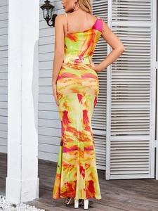 Detail of satin floral maxi dress with vibrant tie-dye print and asymmetrical hem