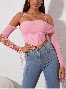 Detail of pink mesh corset top with criss-cross lace-up sleeves and boning structure