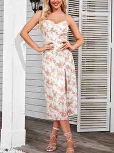 Detail of white floral halter dress featuring delicate lace trim and high side slit