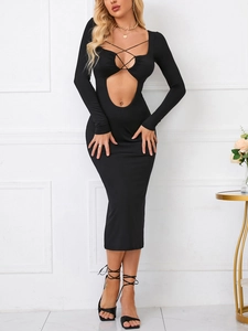 Close-up of black hollow-out dress featuring crisscross lace-up and cut-out details