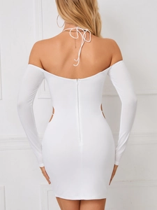 Detail view of the back of a white backless dress with invisible zipper and tie-up neck