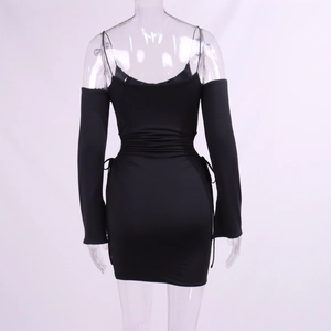 Detail view of back design on black off-shoulder mini dress with drawstring side ties