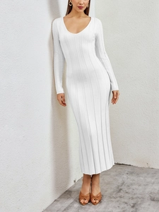 Detail view of white ribbed knit texture and V-neckline on a slim-fit maxi dress