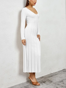 Detailed close-up showing the ribbed texture and side view of the white knitted maxi dress