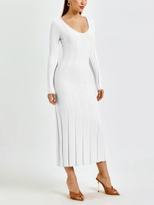 Detailed view of white ribbed knit dress featuring a deep U-neckline and slim fit silhouette