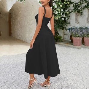 Detailed view of backless black midi dress featuring elegant lace-up cross strap design