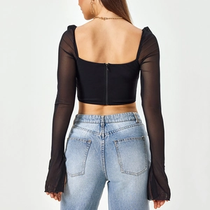 Slim fit black long sleeve crop top with sheer mesh flare sleeves and back zipper