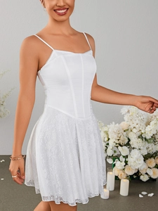 Detailed close-up of white corset dress featuring structured boning and lace A-line skirt