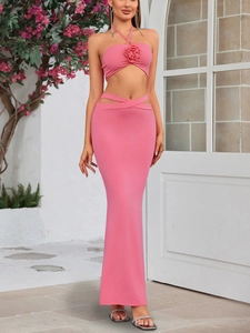 Detail of pink two-piece set with 3D rose halter top and cutout waist maxi skirt