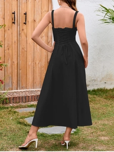 Detailed back view of a black midi dress featuring criss-cross lace-up straps and open back
