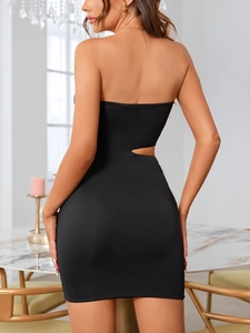 Close-up of a black bodycon mini dress featuring a sexy waist cutout and matte fabric finish