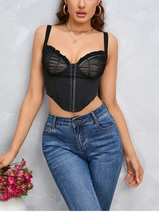 Detail of black mesh corset top with satin panels and front hook-and-eye closure