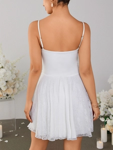 Detailed back view of white lace camisole dress showing adjustable straps and pleated hem