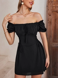 Detail of black puff sleeve mini dress with ruffled off-shoulder neckline and waist tie