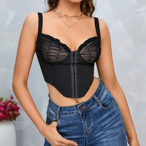 Sexy black mesh corset top with front hook closure and V-hem worn with denim jeans