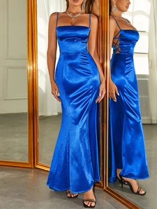 Detailed side view of royal blue satin evening gown with criss-cross lace-up hollow design