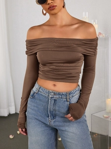 Detail of ruched milk silk brown off-shoulder long sleeve crop top with pleated texture