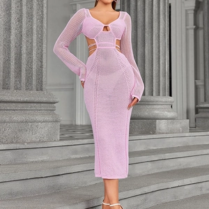 Pink long sleeve crochet knit dress with sexy side cut-outs and a slim fit bodycon style