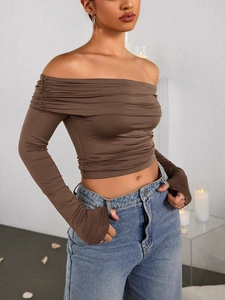 Side view of fitted coffee brown off-shoulder long sleeve top with ruched details