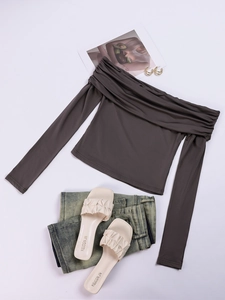 Detailed flat lay of brown off-the-shoulder long sleeve top with ruched neckline