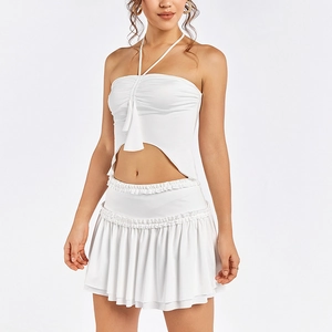 White halter neck crop top and tiered pleated mini skirt two-piece summer set