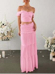 Pink milk silk two-piece set featuring off-shoulder crop top and layered ruffle cake skirt
