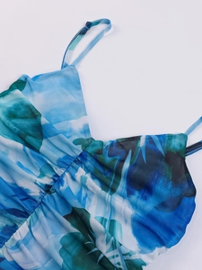 Detail of the mesh floral dress neckline featuring blue abstract print and adjustable straps