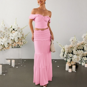 Pink off-shoulder ruffle crop top and tiered maxi skirt set for elegant beach weddings