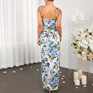 Elegant floral satin backless maxi dress with adjustable straps and large blue bow detail