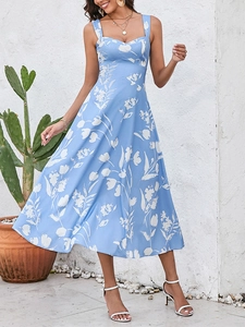 Detail of light blue floral print maxi dress featuring heart-shaped neck and wide straps