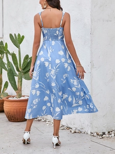 Detail of floral spaghetti strap maxi dress featuring elastic smocked back and sky blue print