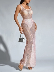 Close-up detail of shimmering pink sequins and sheer mesh fabric on a sexy party dress