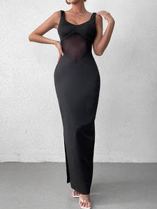 Detail of a black bodycon maxi dress featuring mesh waist paneling and side split design