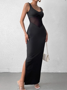 Detail view of the black bodycon maxi dress with mesh waist inserts and high side slit