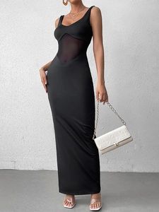 Detail of sexy black bodycon maxi dress featuring mesh patchwork and side slit design