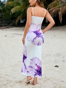 Detail view of floral print beach dress showing smooth fabric and purple hibiscus pattern