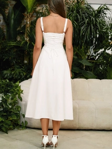 Detailed back view of white lace-up dress with crisscross tie and elegant A-line silhouette