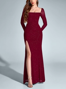 Close-up of sparkling burgundy dress showing square neckline and silver glitter mesh fabric