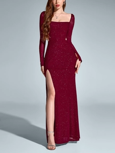 Detail of the elegant wine red gown featuring shimmering silver glitter and a high leg slit